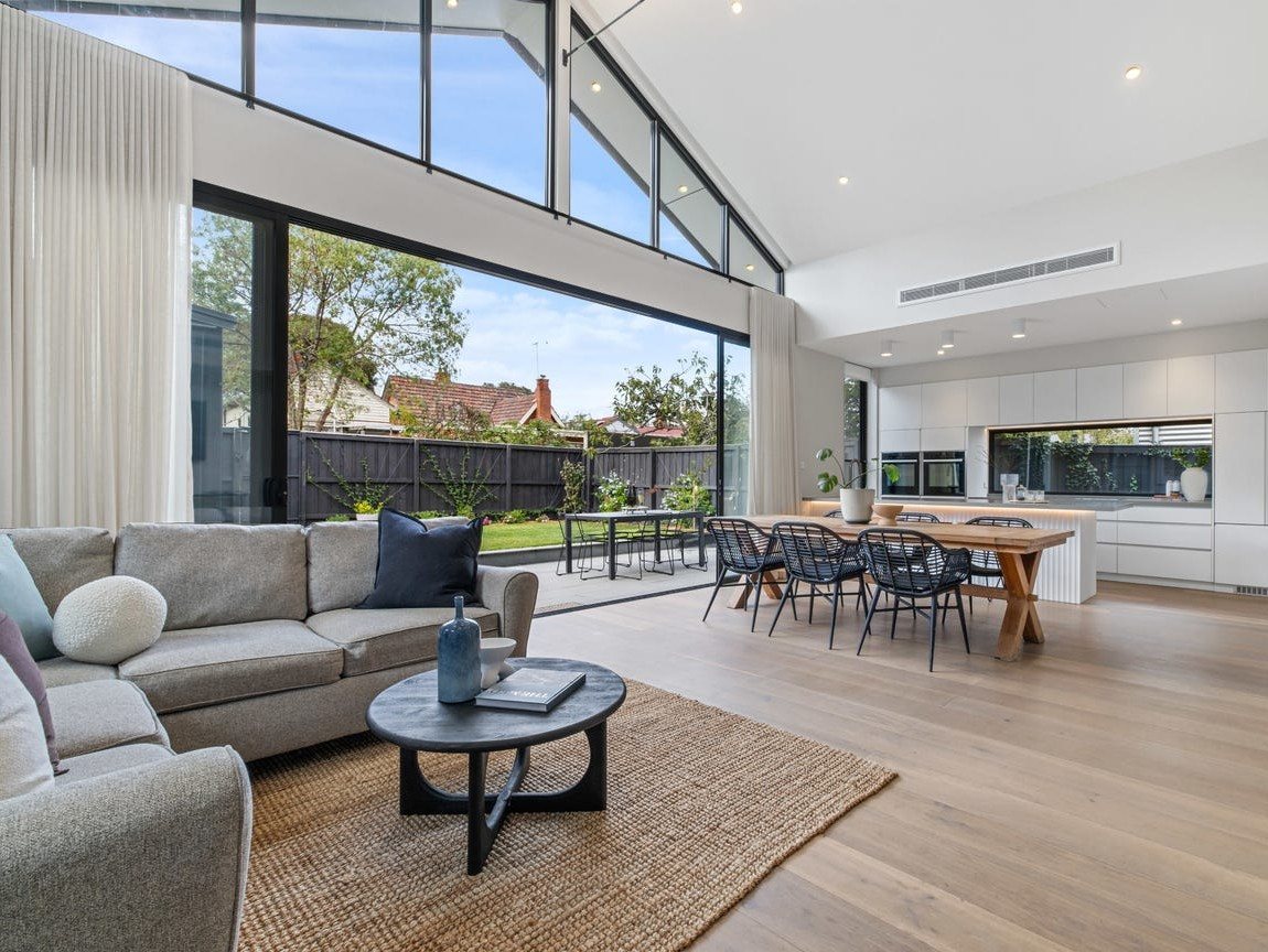 Thornbury renovation: open-plan living and dining under a raked ceiling