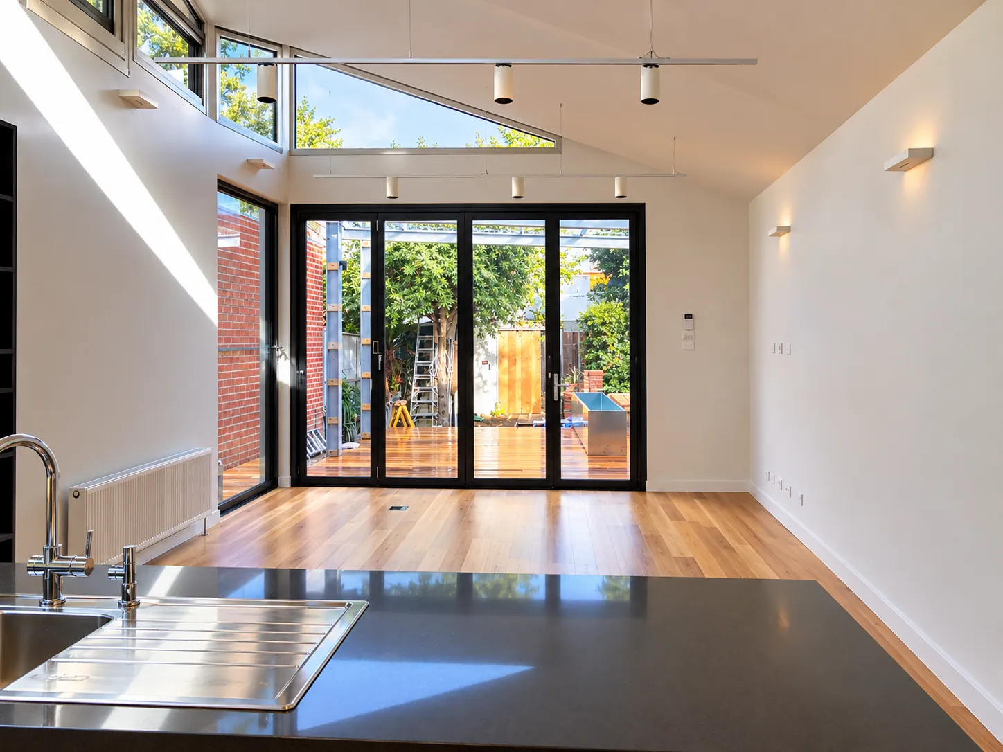 Folded origami plaster ceilings to reflect the light through highlight louvre windows — Elwood extension and upgrade - also heritage work in Elwood, Melbourne