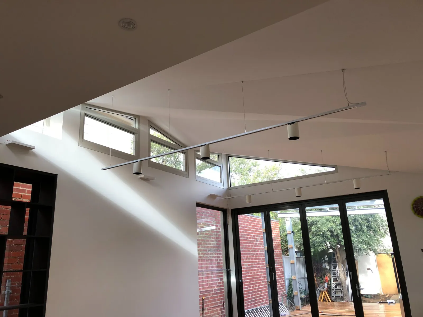 Folded origami plaster ceilings to reflect the light through highlight louvre windows — Elwood extension and upgrade - also heritage work in Elwood, Melbourne